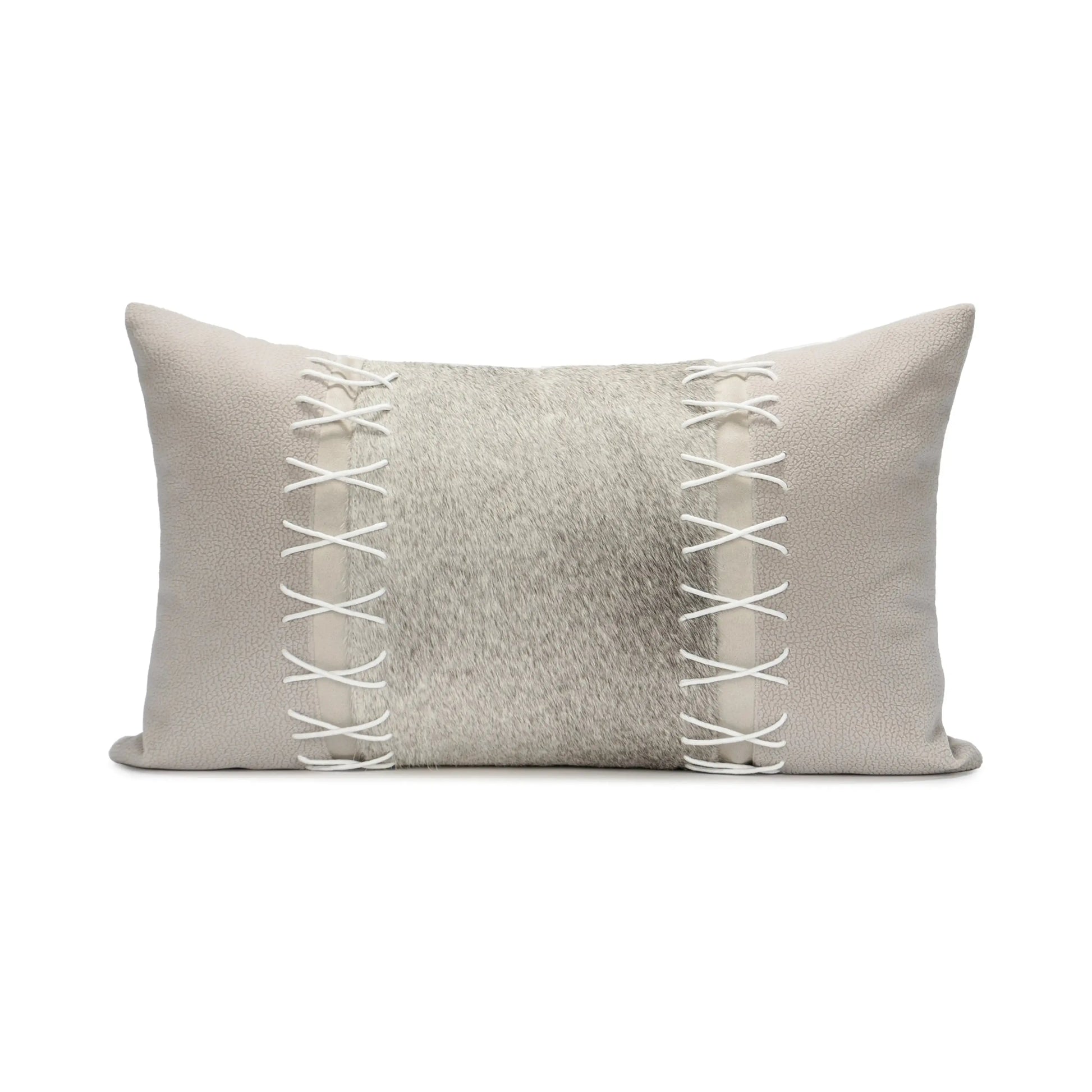 Gray pillow with white lace detailing on a white background