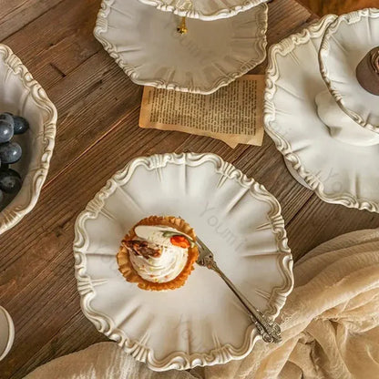 Decorative white plates with a small dessert