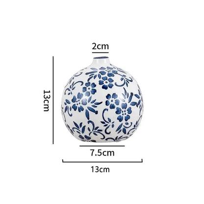 Ceramic vase with blue floral patterns and measurements