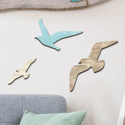 Wooden seagull wall decorations on a light-colored wall 