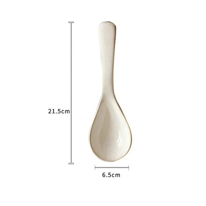 White ceramic spoon with measurements on a white background