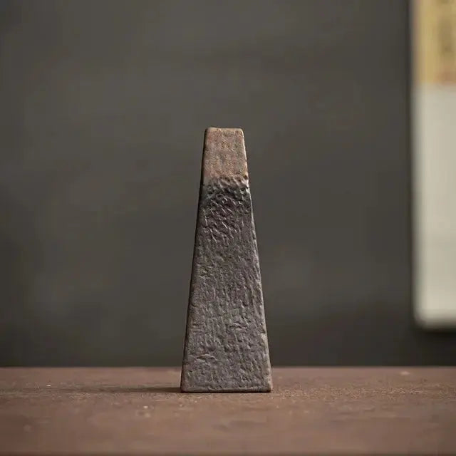 Textured rectangular object on a wooden surface