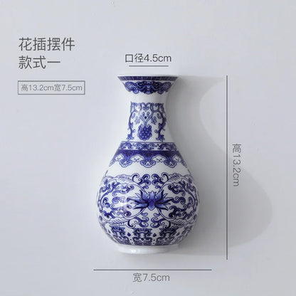Blue and white ceramic vase with intricate patterns, shown with dimensions on a light gray background.