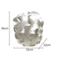 White decorative object with dimensions indicated on a white background
