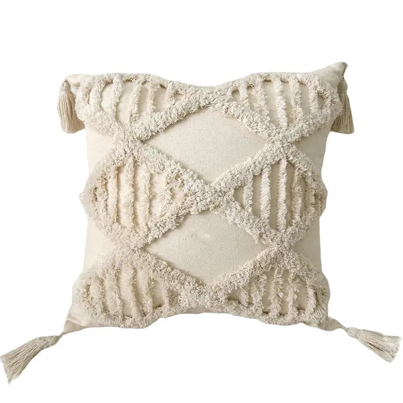 Decorative pillow with macrame pattern on a white background